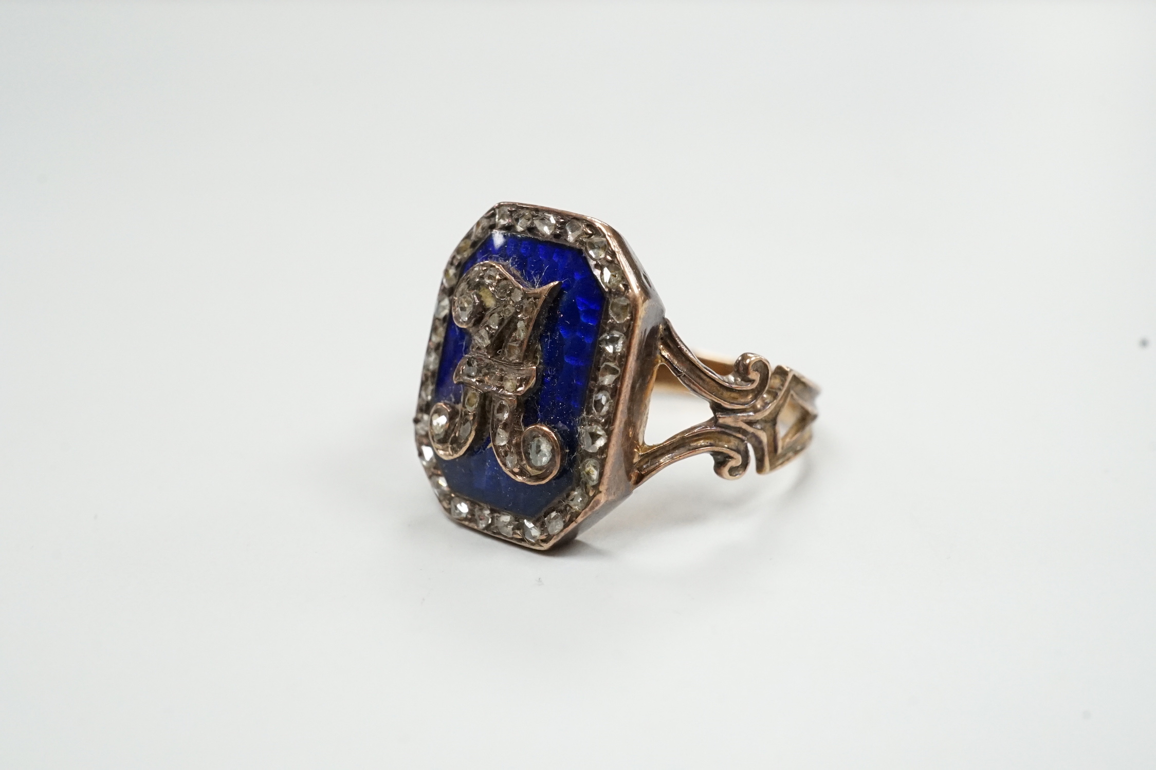 A 19th century yellow metal (stamped 18), enamel and rose cut diamond set initial ring, size H/I, gross weight 4.9 grams.